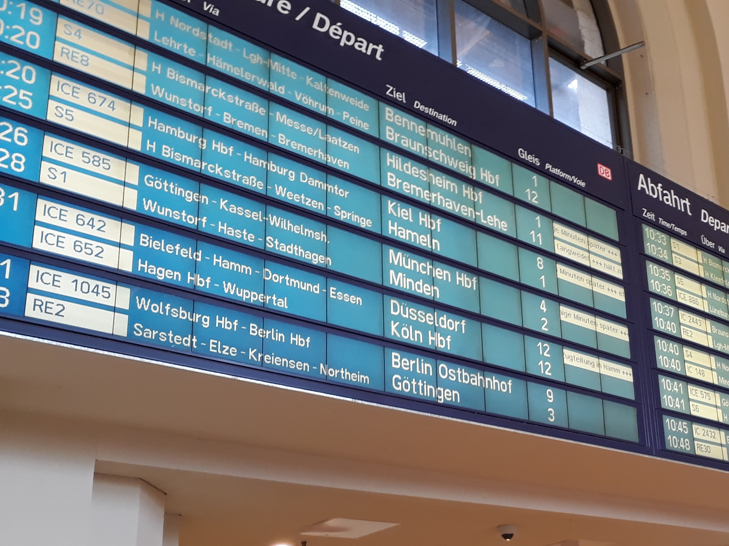 A departures screen in a German railway station